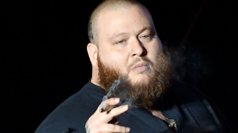 Action Bronson holding cigar