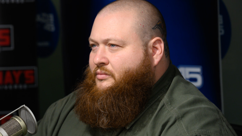 Action Bronson in front of microphone 