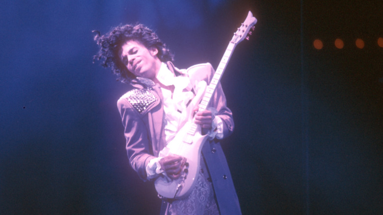 Prince playing guitar