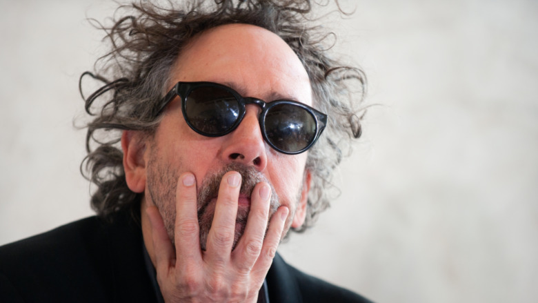 Tim Burton with hand on mouth