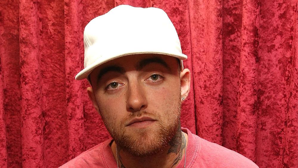 Mac Miller in white cap