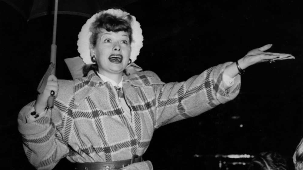 lucille ball holding an umbrella