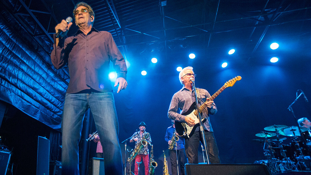 Huey Lewis and Johnny Colla on stage