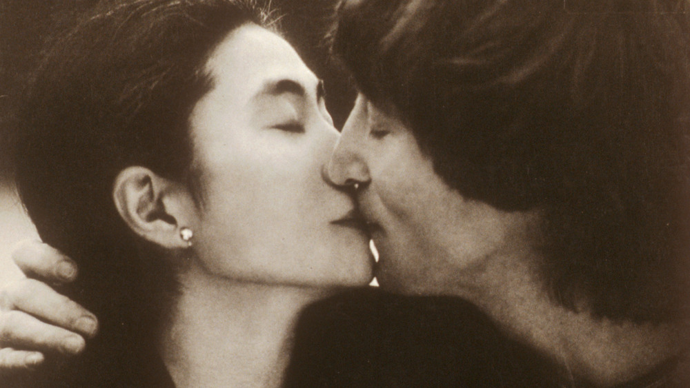John Lennon kissing Yoko Ono