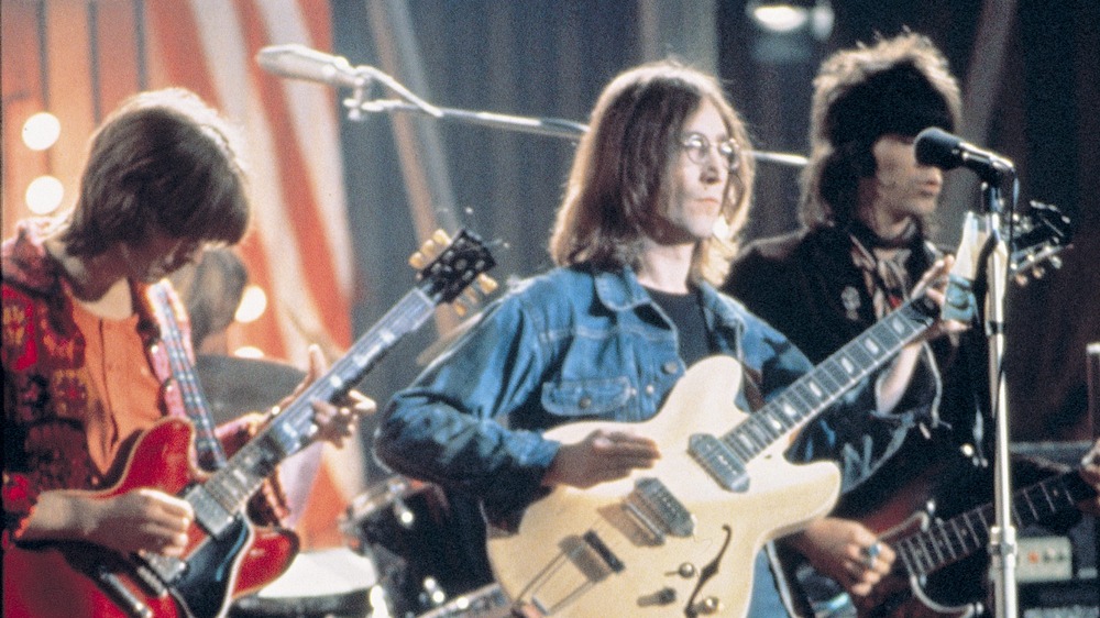 Keith Richards and John Lennon playing guitar