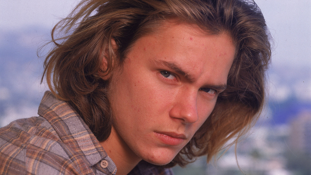 River Phoenix looking serious