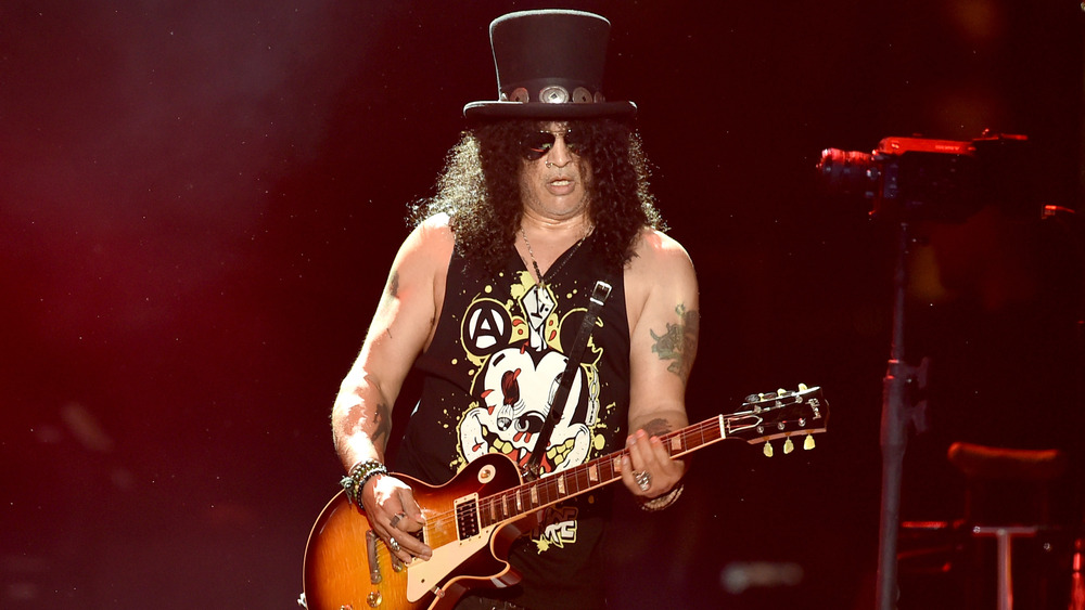 Slash onstage playing guitar