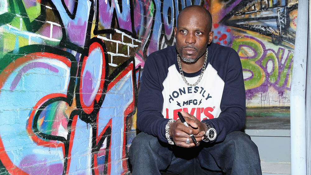 dmx sitting on stairs graffiti