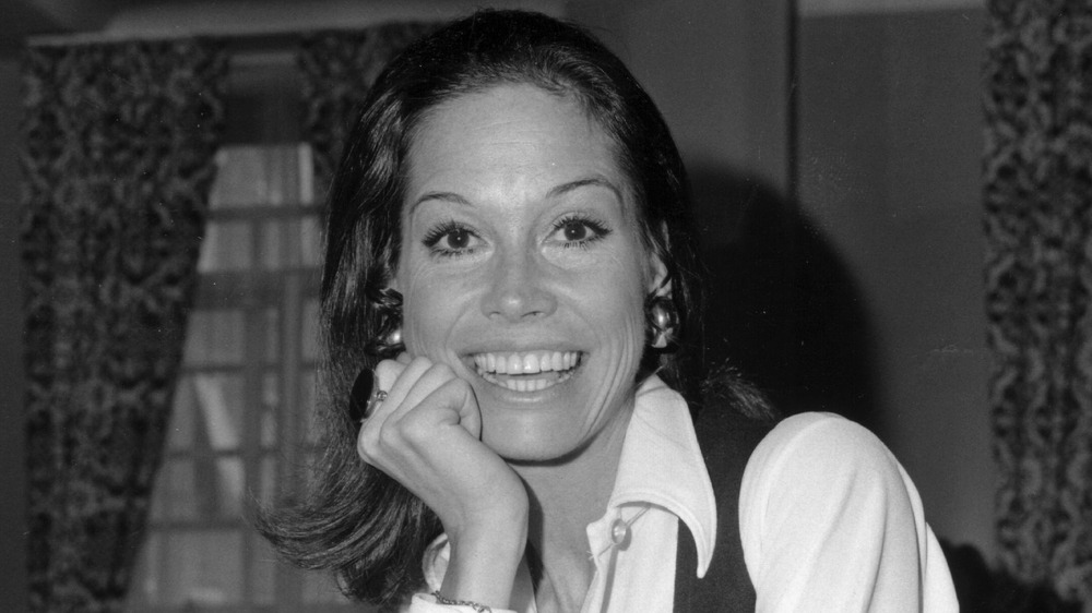 Mary Tyler Moore with her hand against her face