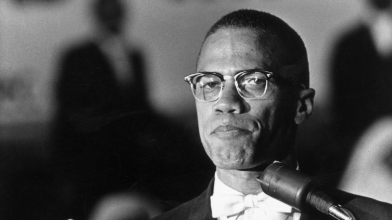 Malcolm X at microphone