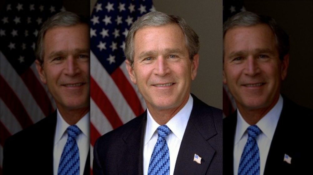 fU.S. President George W. Bush in front of flag