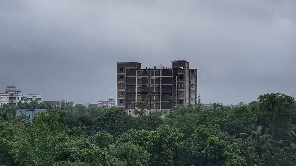 Tazrin garments building against cloudy sky