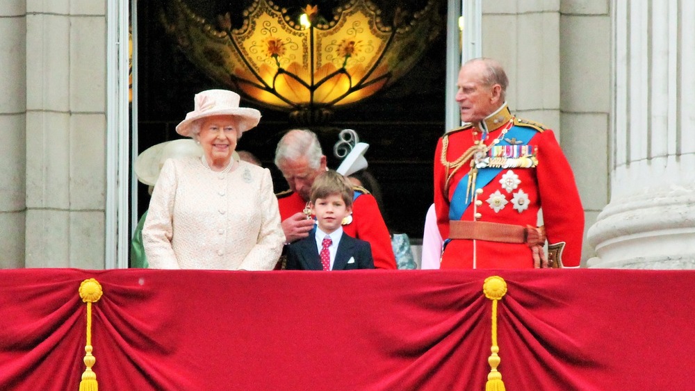 Queen Elizabeth, Prince Charles, Prince Philip, and some kid