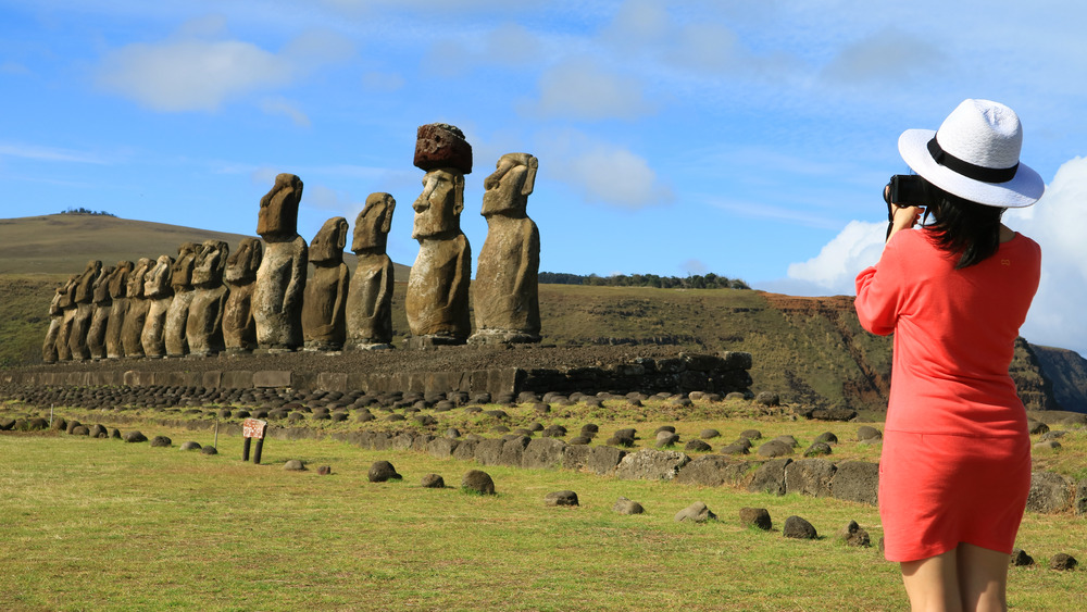 Tourist photographing the moai