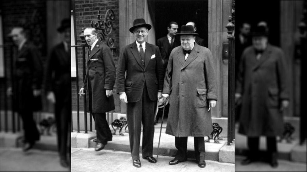 Joseph Kennedy with Winston Churchill standing