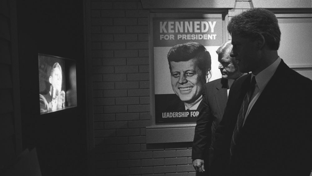 President Bill Clinton and Senator Ted Kennedy view exhibits 