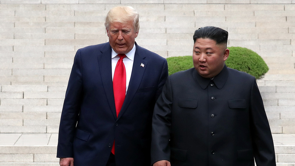 Donald Trump and Kim Jong-un walking 