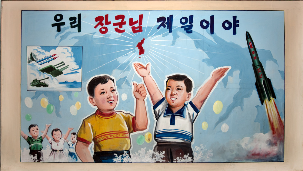poster depicting young boys amidst missiles