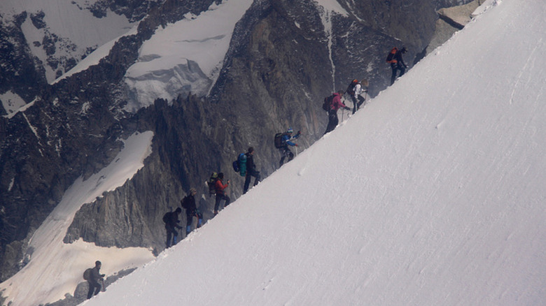 mountain climbers going uphill 