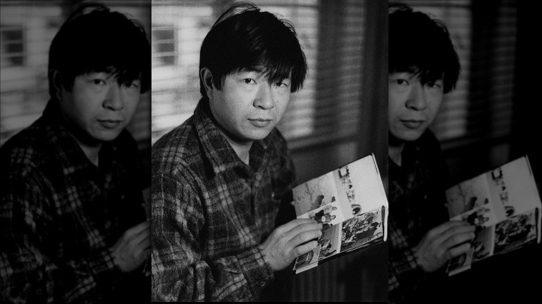 Naomi Uemura holding book