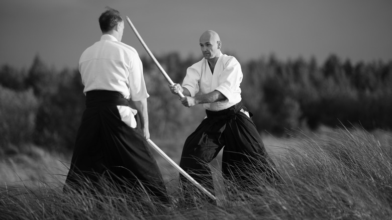 Japanese sword fighters in field