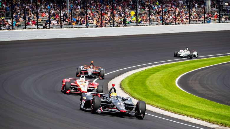 Cars race the Indy 500 
