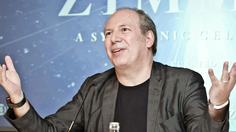 Hans Zimmer with hands in air