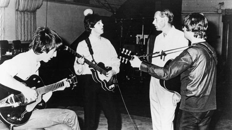 The Beatles with George Martin in 1964