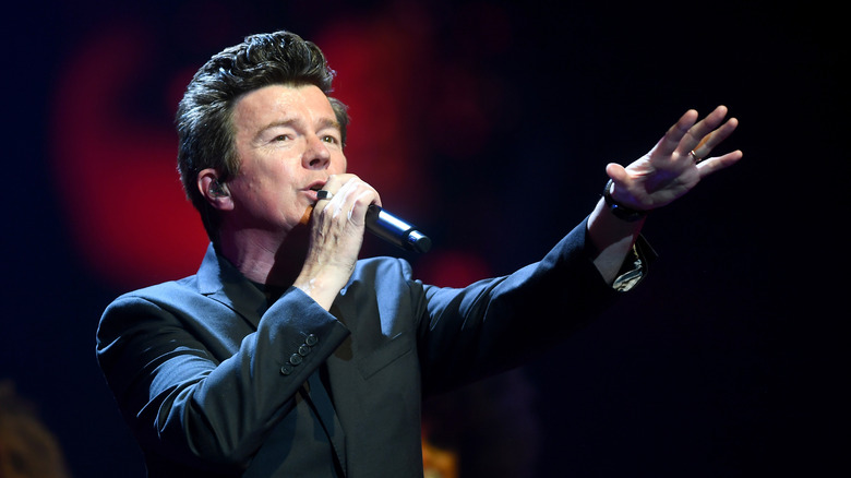 Rick Astley singing with microphone