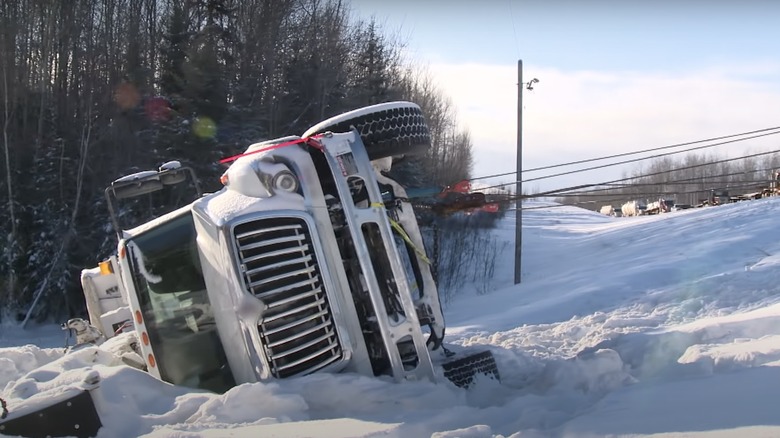 Truck flipped in the snow