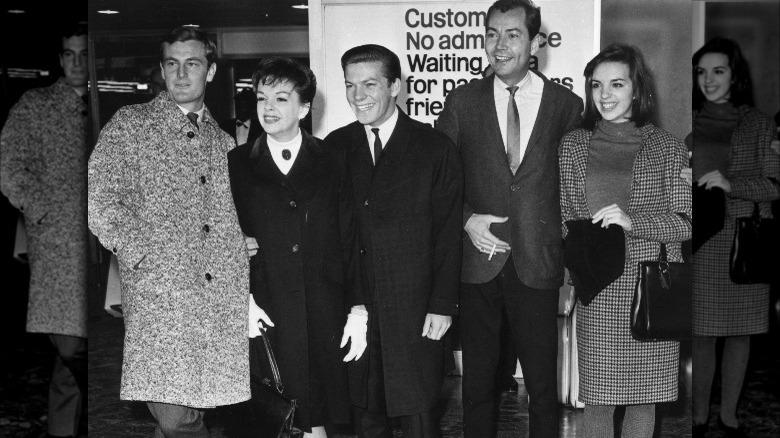 judy garland, liza minnelli, peter allen, and mark herron standing