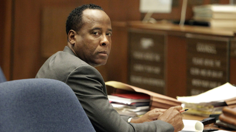 Conrad Murray at a desk