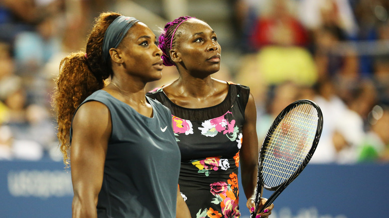 Serena and Venus Williams on the court together in 2013