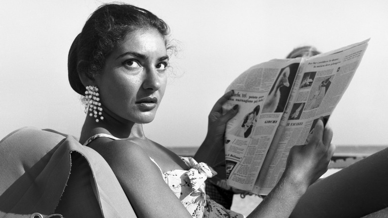 Maria Callas reading a newspaper