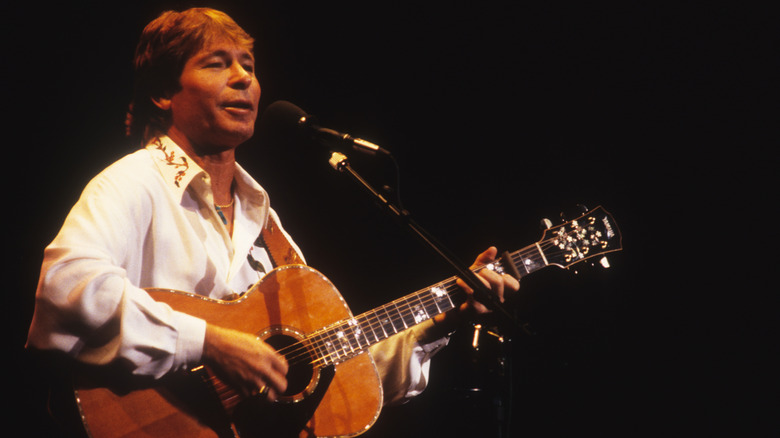 John Denver playing guitar