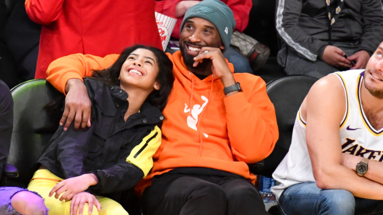 Kobe Bryant with his daughter at a Lakers game 