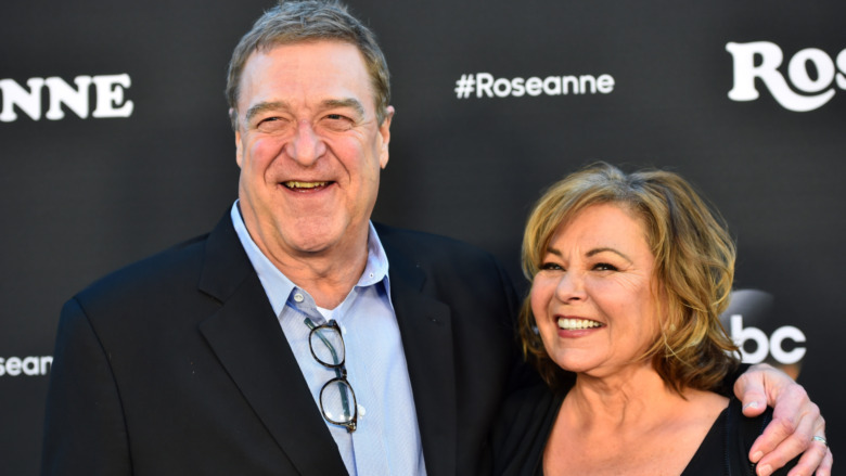Roseanne Barr and John Goodman smiling
