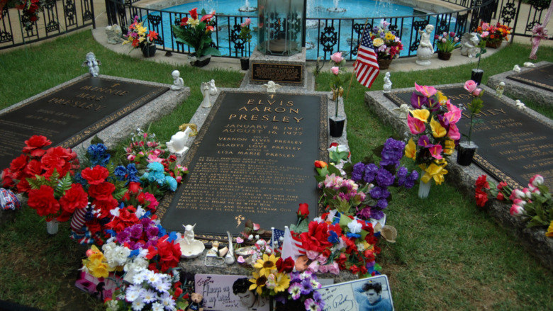 Cropped photo by Midnight Believer via Flickr of Elvis Presley's grave at Graceland 