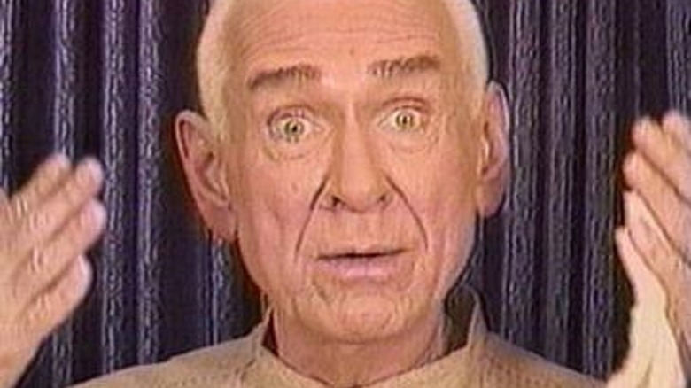 Cropped still of a Heaven's Gate promotional video featuring  Marshall Applewhite