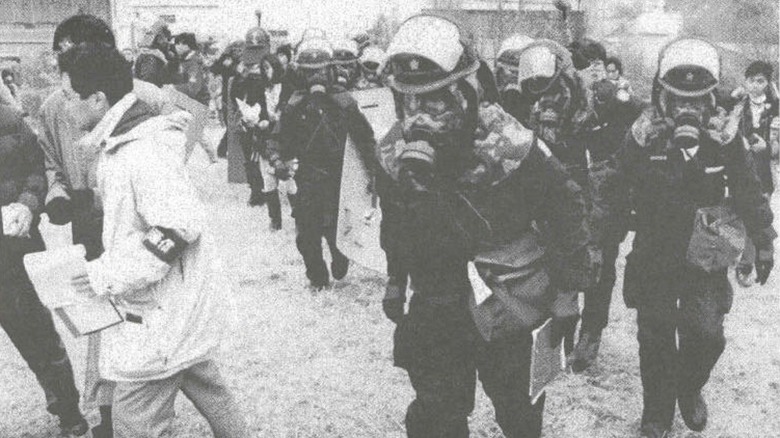 Cropped photo of Japan Defense Force (JDF) Chemical troops and emergency responders on the scene of the Sarin attacks in 1995