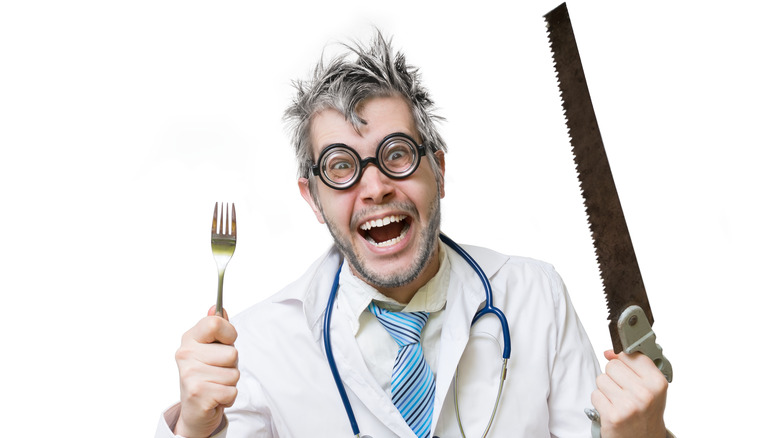 Surgeon with fork and saw