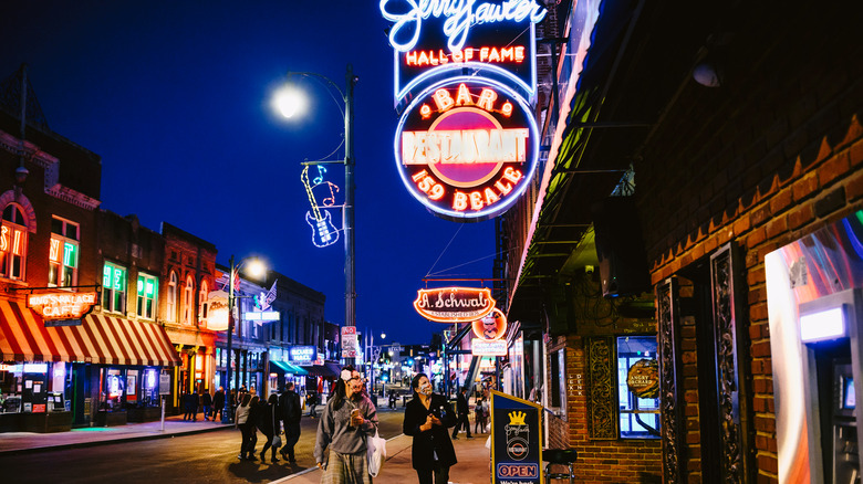 neon signs on street at night