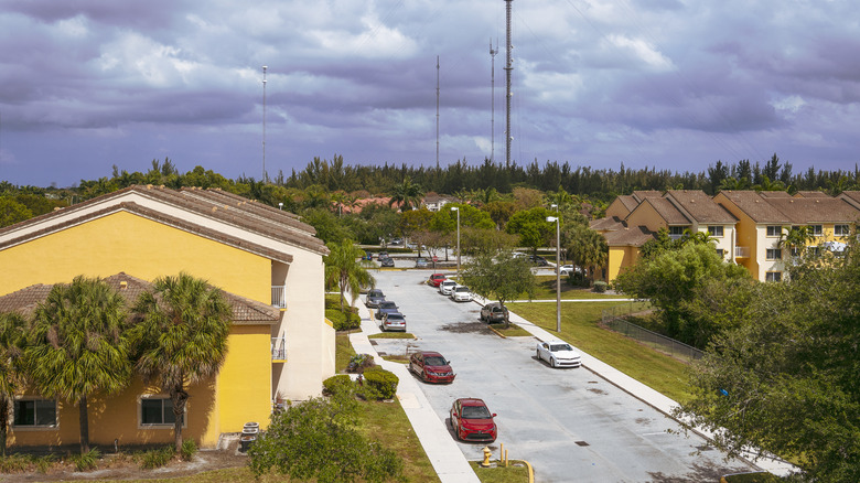 cloudy sky over neighborhood of yellow condos