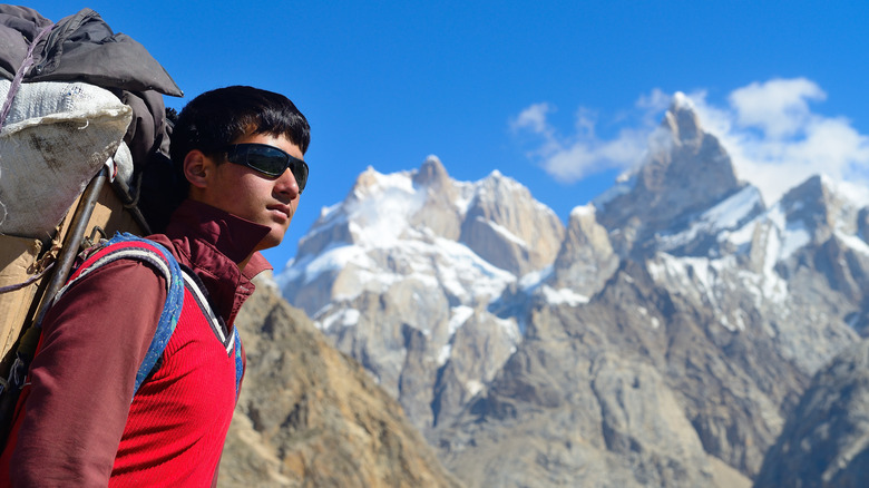 A young porter crossing Baintha Brakk mountain