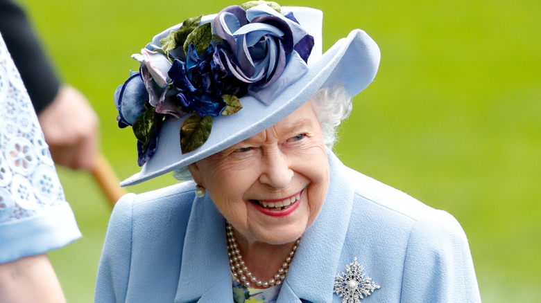 Queen Elizabeth II blue hat with flowers