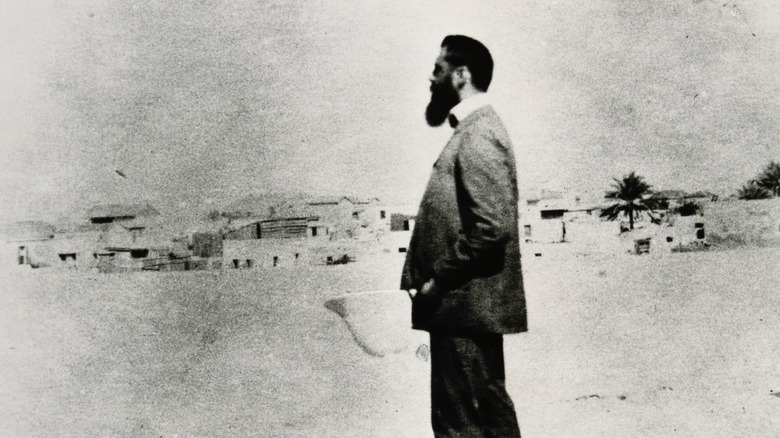 Theodor Herzl in Palestine standing with hands in pockets