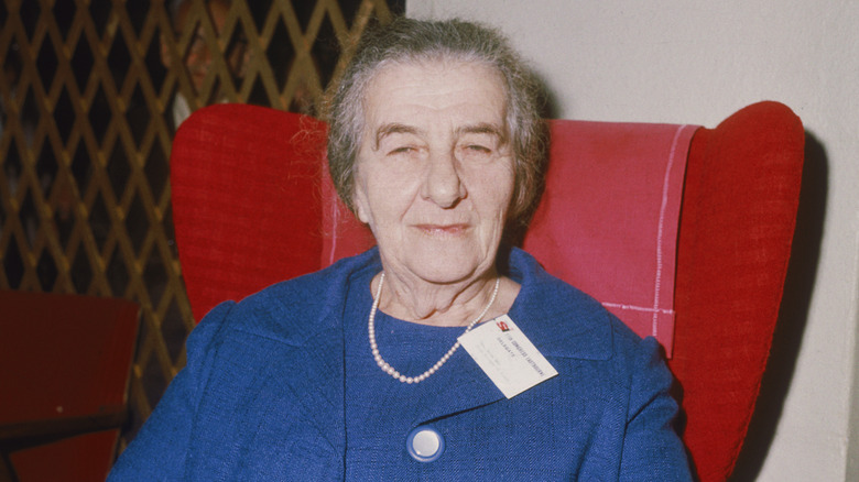 Golda Meir in red chair