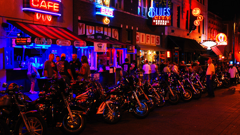 Motorcycles lined up outside a bar