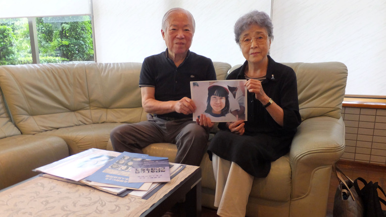 Megumi Yokota's parents holding photo