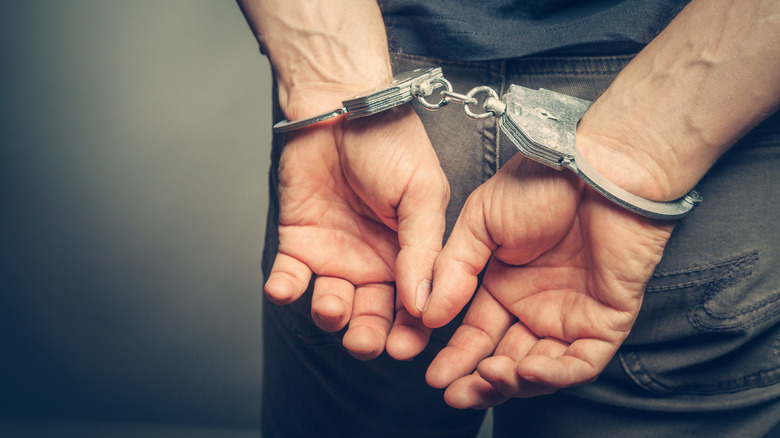 male hands in handcuffs